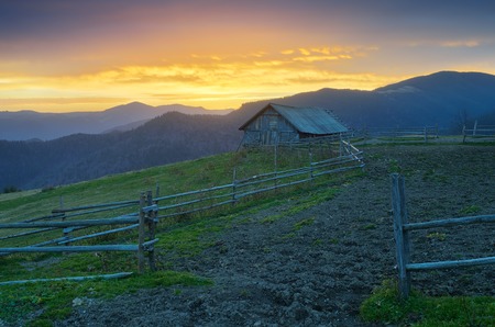 Rural landscape at dawn  Farm in a mountain valleyの写真素材