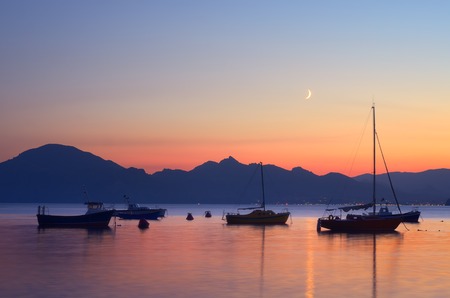 Night landscape with boats and yachts in the seaの写真素材