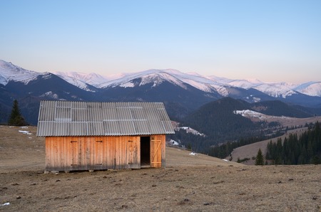 Spring landscape with small wooden house for hay  Carpathian mountains, Ukraine, Europeの写真素材