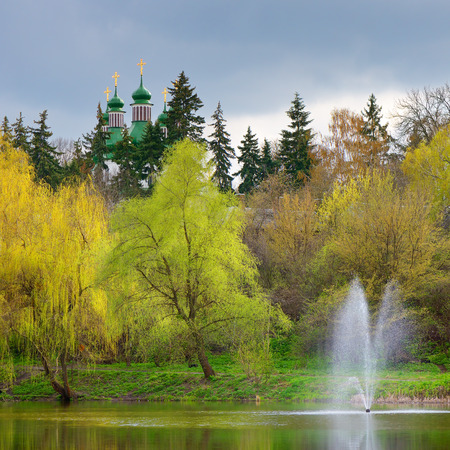 Summer landscape with a monastery on a hill near the pond  Sunny day  Kyiv, Ukraine の写真素材