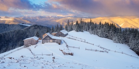 Morning in the mountains. Winter landscape. Wooden houses. Carpathians, Ukraine, Europeの写真素材