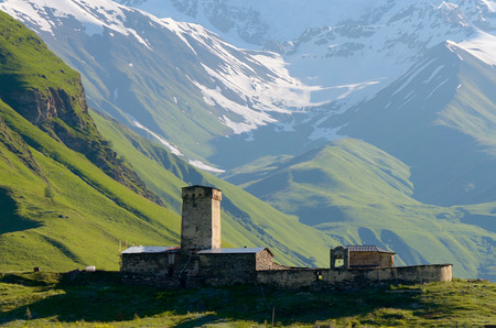 Stone medieval church in a mountain valley. View of Mount Shhara. Ushguli community, Zemo Svaneti,...