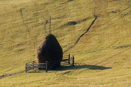 Haystack on a mountain meadow. Rustic look. Carpathians, Ukraine, Europeの写真素材