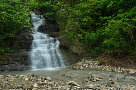 Spring landscape with the river. Beautiful waterfall in the mountainsの写真素材