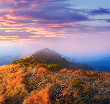 Morning landscape in the mountains. Colorful sunrise with a beautiful sky and mistの写真素材