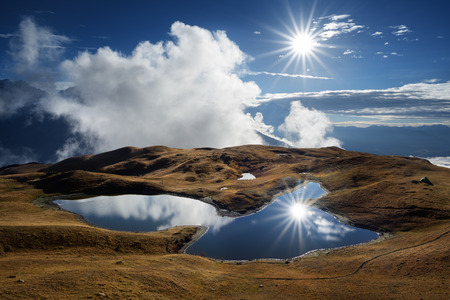 Mountain Lake. Sunny day with blue sky. Beautiful sun rays. Lake Koruldi. Caucasus, Georgia, Zemo Svanetiの写真素材