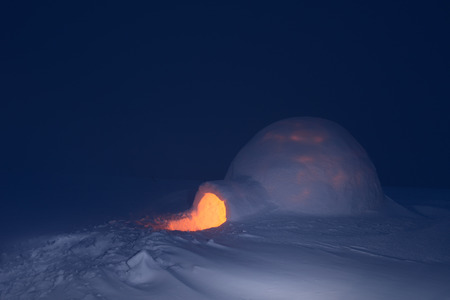 Snow igloo with light. Night in mountains. Adventure tour. House for touristsの写真素材