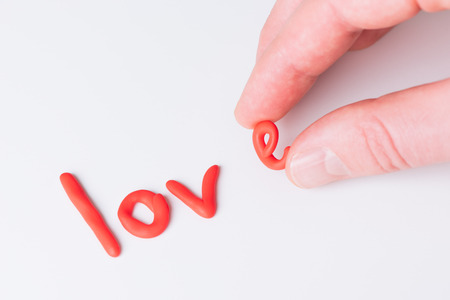 Concept of Valentines Day. Word love with red letters on white backgroundの写真素材