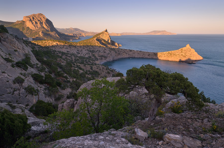 Landscape with a seaside resort. View from the mountain to the sea, bays and capes. Beautiful light of the evening sun. Crimea peninsula. Ukraine, Europeの写真素材