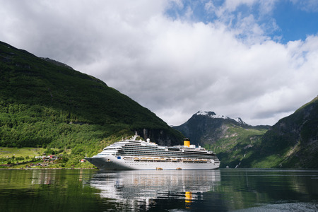 Cruise liner in the fjord. Geirangerfjord near the town of Geiranger, Norwayの写真素材