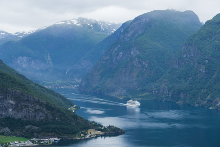 Cruise liner in the fjord of Aurlandsfjord near the village of Flam, Norwayの写真素材