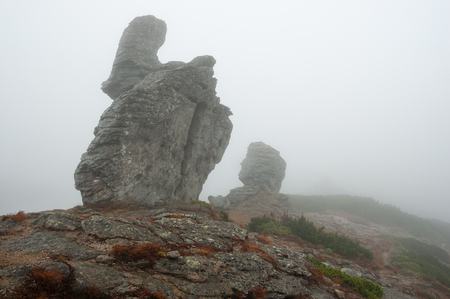 Autumn landscape with fog. Rocks in the mountainsの写真素材