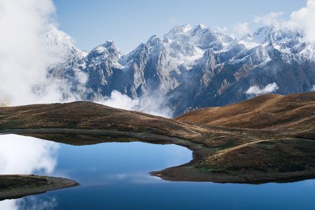 Landscape with a mountain lake. Day with beautiful clouds. Lake Koruldi. Main Caucasian ridge. Zemo...