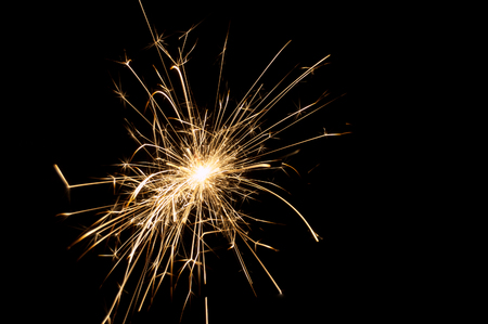 Festive Christmas sparklers on a black backgroundの写真素材