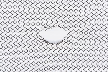 Abstract background with geometric pattern. Wire fence in the snow