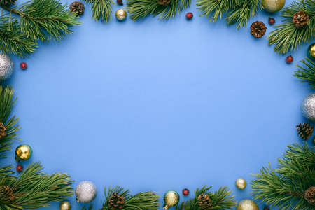 Blue Merry Christmas and Happy New Year background with oval frame. Top view, flat lay with copy space for textの写真素材