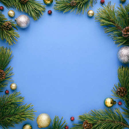 Christmas card with round frame on blue background. New Year banner with copy space. Top view, flat layの写真素材