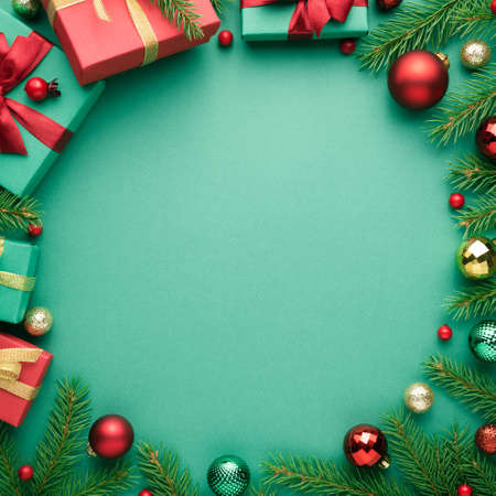 Christmas card with circle frame on turquoise background. Blank with copy space for advertising text. Top view, flat layの写真素材