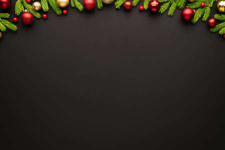 Christmas background with decorative frame of Christmas tree ornaments. Top view, copy space for festive textの写真素材