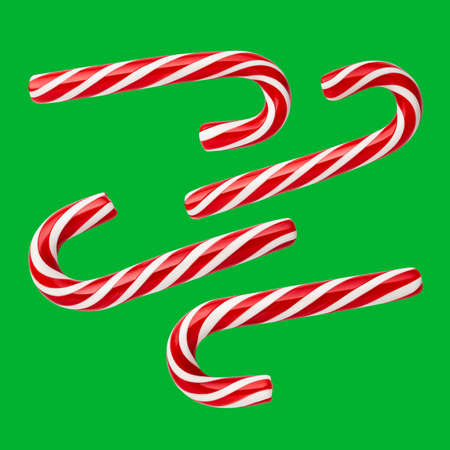 Christmas candies - handmade peppermint candy canes. Set of festive sweets on a green (chromakey) backgroundの写真素材