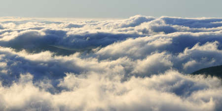 Majestic view at dawn. Clouds in the mountains. Natural backgroundの写真素材