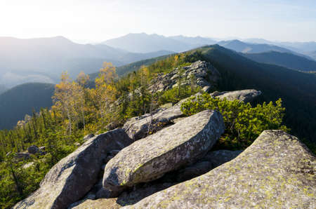 Autumn mountain landscape with large stones and rocks on a sunny dayの写真素材