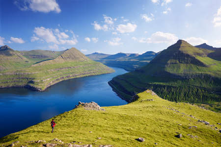 Hvithamar mountain ridge with a panoramic view of the Funningur fjord, Faroe Islandsの写真素材