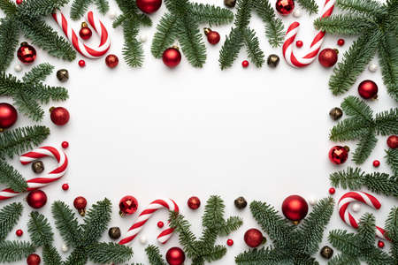 White background with holiday frame and Christmas balls, for design. Banner or poster template with place for textの写真素材