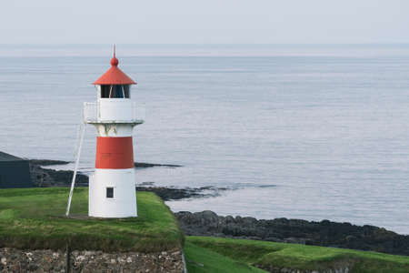 Skansin Lighthouse towers over the fortress in Torshavn, Faroe Islandsの写真素材