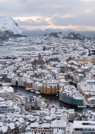Winter evening view from Aksla mountain to the snowy town of Alesund in Norwayの写真素材