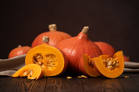 Still life with Cut Hokkaido Pumpkin or Red Kuri Squashの写真素材