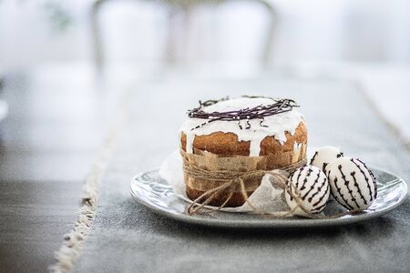 Close-up, background, Easter bread on a plate with three eggs, copy spaceの写真素材