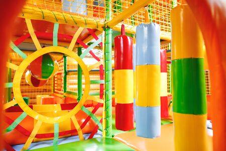 Modern inflatable playground for children indoor. Colorful kids zone with punching bagfor and rubber ball playingの写真素材