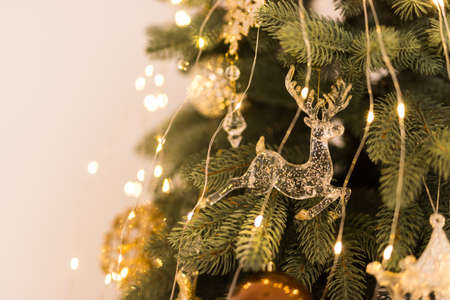Christmas tree decorated with toys and garlands on a white background.の写真素材