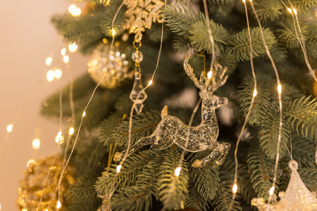 Close up of holidays toys and garlands on Christmas tree. Concept of Christmas and New Yearの写真素材
