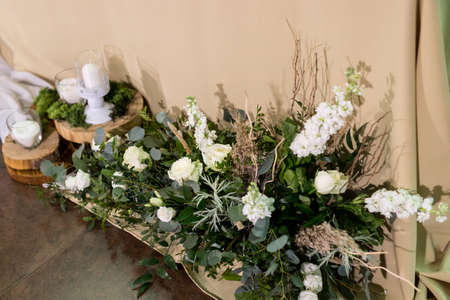 Close up of wedding ceremony with arch in rustic style with fresh flowersの写真素材