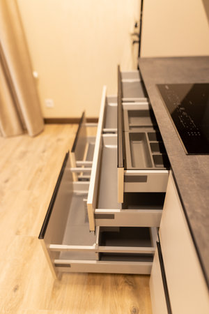 Close up of a set of drawers in a modern kitchen.の写真素材