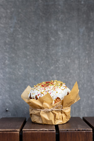 Easter cake on a wooden table against the background of a gray wall