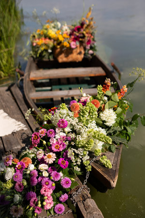 Flower bouquet in a boat on a lake in the Netherlandsの写真素材