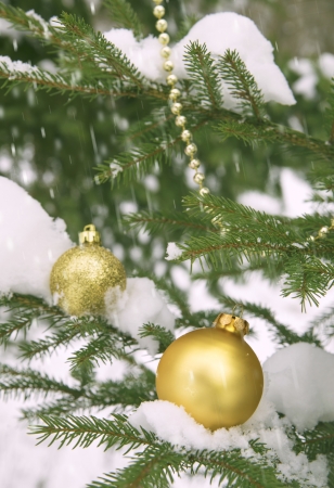 Toy ball and snowman over fir tree.の写真素材