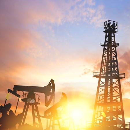 Oil pumps and derricks over sunset background. Vector illustration.のイラスト素材