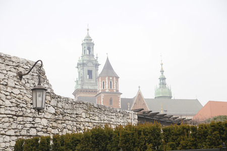 The Wawel castle over ancient stone wall in Krakow, Poland.のeditorial素材