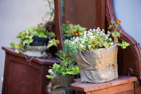Flowers are near a flower shop on a city street.の写真素材