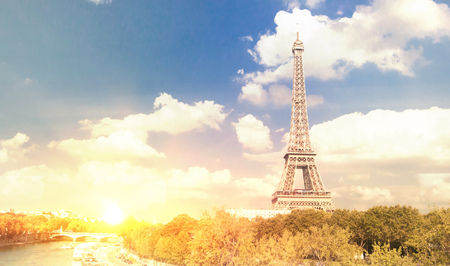 Eiffel tower and beautiful sky over the city buildings. Urban paris background.の写真素材