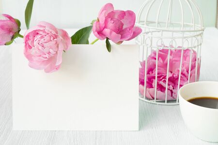Small bird cage with peony flower bouquet,の写真素材