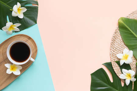 Cup of black coffee with fresh tropical leaves.の写真素材