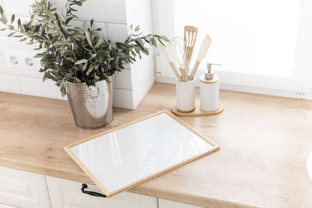 Mock up frame in kitchen interior background. Scandinavian home design.