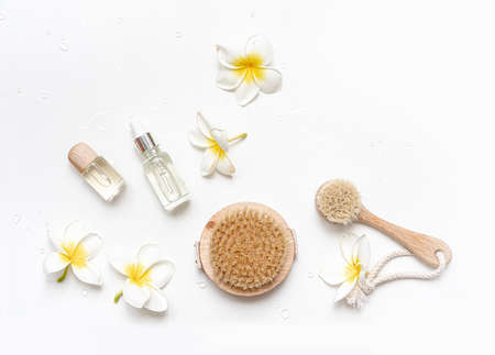 Bottle essential oils on tropical background. Skin and body care treatment concept.の写真素材