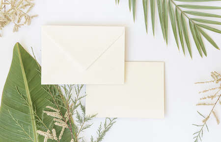 Styled summer wedding desktop stationery mockup. Blank greeting and invitation card. Green tropical...
