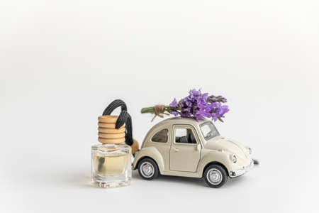 A small car and a bouquet of lavender. Delivery and gifts concept.の写真素材